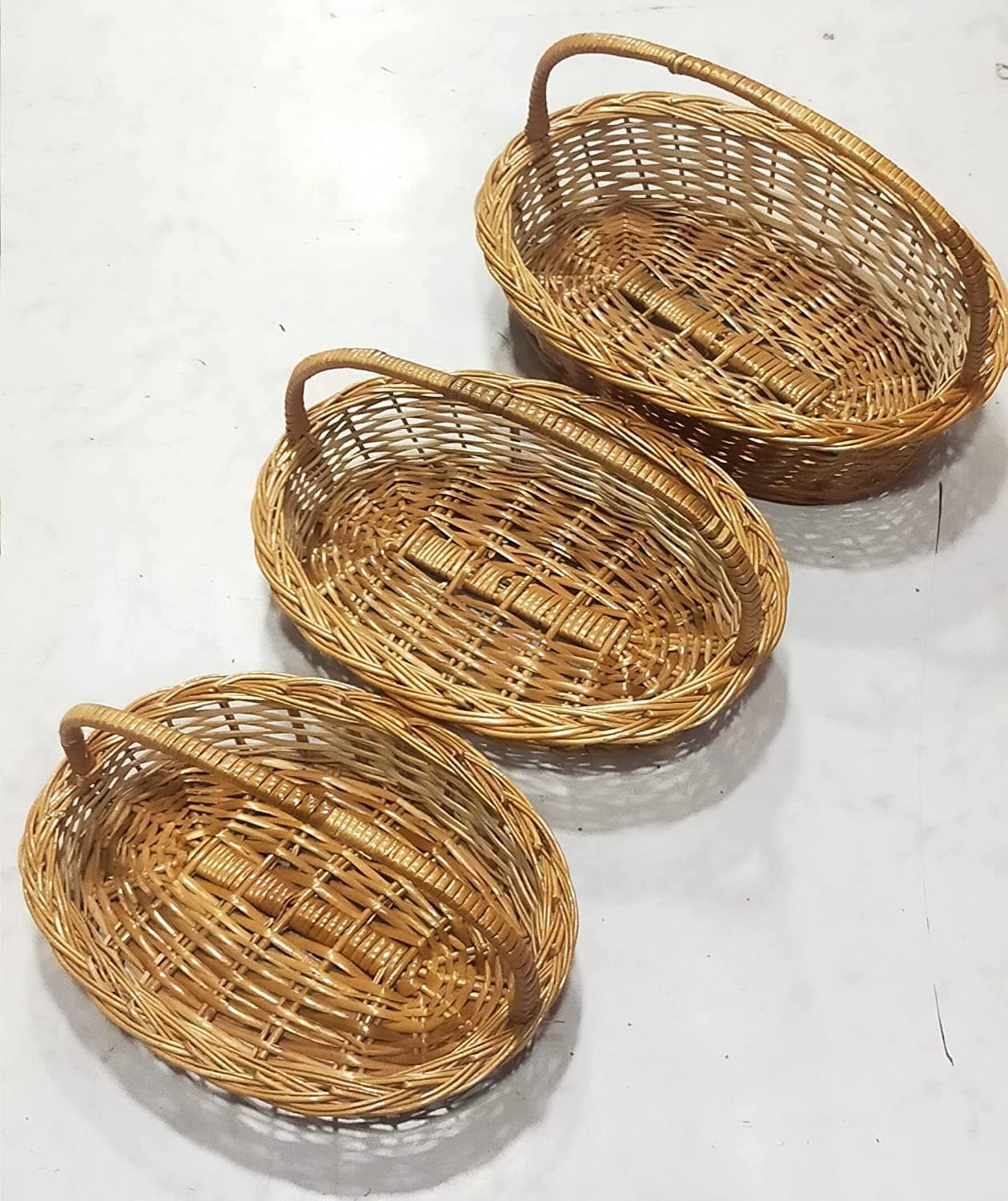 Avika Oval Handle Cane Bamboo Basket for Multipurpose uses for Hamper Chocolate Flower Pooja Cane Basket,Festival Gifts Packing with Handle Set of 3 Baskets. Size 14 inch, 13 inch,12 inch