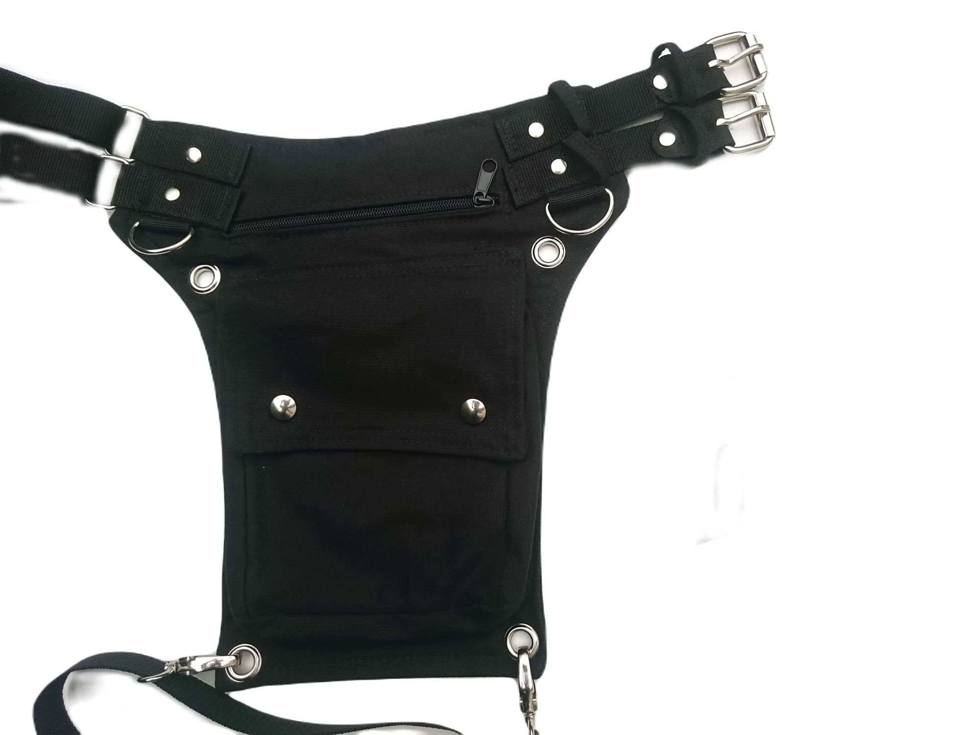 Black canvas utility belt with removable leg strap, square flap and 2 inch wide waist strap with metal buckle